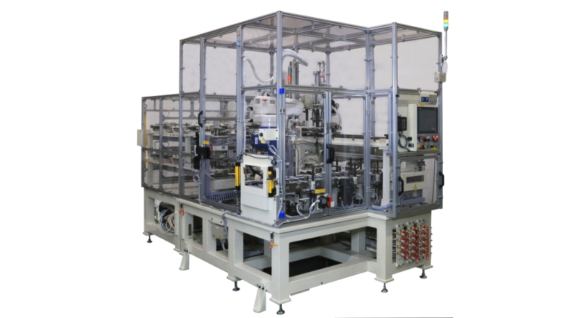 Cam cap assembly machine